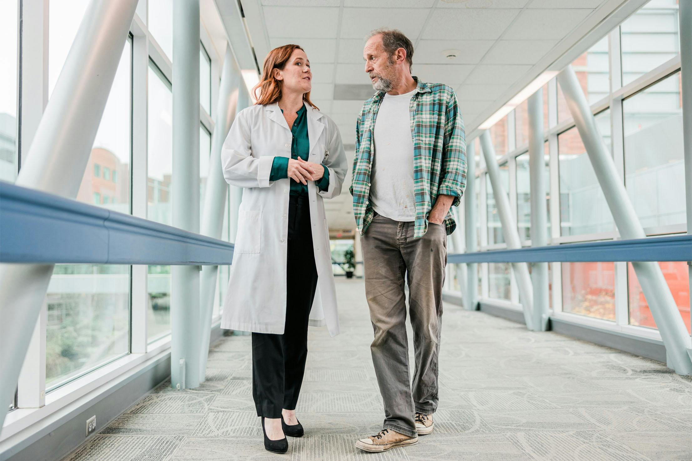 Image from Salem Health brand campaign; doctor speaking with Homeless man